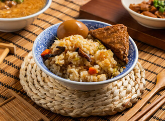 Cabbage Rice with fried tofu, spiced corned egg chopsticks and spoon served in bowl isolated on mat side view of taiwan food