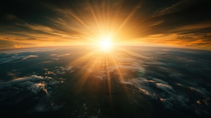 Fototapeta premium A radiant sunrise illuminates the horizon, casting atmospheric light through the clouds, creating a stunning natural spectacle that suggests beauty, hope, and a new day.