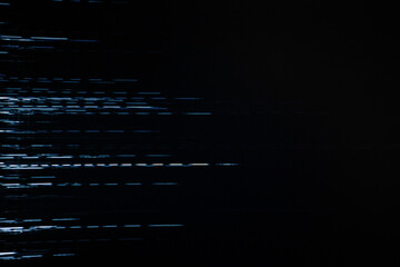 An abstract image featuring a digital glitch effect with horizontal white lines against a dark...
