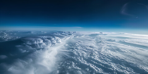 Fototapeta premium The sky is filled with clouds and the sun is setting. The clouds are white and scattered throughout the sky