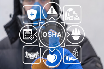 Industrial worker uses on a virtual screen of the future and sees the acronym: OSHA. OSHA - Occupational Safety and Health Administration Industry concept.