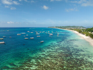 Tourist boats floating over turquoise sea water. Boracay. Island in Malay, Aklan. Philippines.