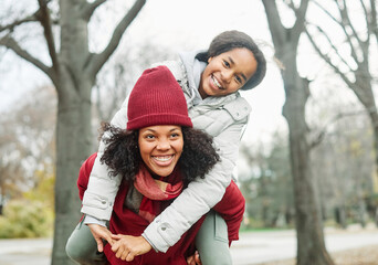 mother child daughter fun family woman girl happy together piggyback smiling cheerful togetherness...