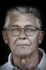 Detailed Close-up Portrait of an Elderly Man Wearing Glasses, Showcasing His Facial Features, Wrinkles, and Expression.