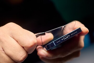 Carefully Applying a Screen Protector on Your Smartphone for Enhanced Protection and Longevity