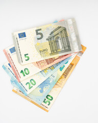 Euro banknotes isolated on white background. Euro cash background. Background from several euro paper cash. 