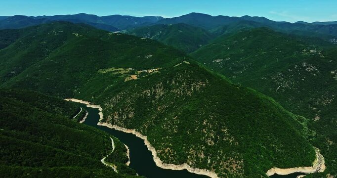 Vibrant Landscape Shot Of Water Body Meandre Curved Around Hill Forest Area