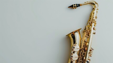 A Golden Tenor Saxophone Resting on a White Surface