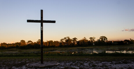 cross on the hill at sunset