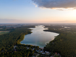 Aerial landscape skyline view of Powidz lake and Anastazewo beach (Jezioro Powidzkie, Plaża Anastazewo) at sunset. Popular summer resort in Wielkopolska, Poland