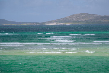 Turquoise sea and waves on a spectacular beach in the north of Scotland. Isle of Harris, Scotland