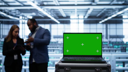 Isolated screen laptop in data center running error checking software monitoring hardware bugs....