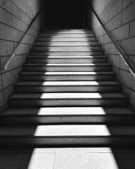 Fototapeta premium Shadows on Steps Leading to Darkness