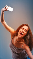 Young woman throwing smartphone and screaming with rage