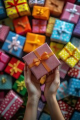Female's hand holding a gift box