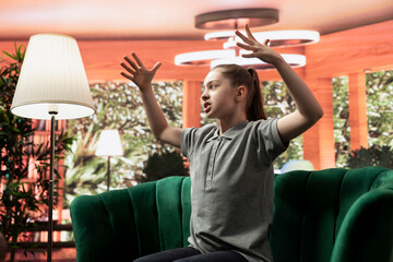 Angry teen expresses frustration during a therapy session, showing signs of bullying, aggression...