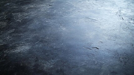 Close-up of a textured, dark gray surface with a subtle sheen.
