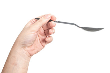 Female hand holding a black plastic spoon isolated on white background.