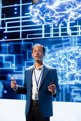 Computer scientist speaking at tech event, explaining impact of AI technology using AR...
