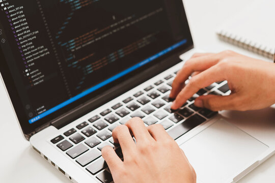 Digital technology, software development concept. Developing programmer, software developer coding computer code on laptop computer. Perfect for coding, IT solutions, applications, coding javascript