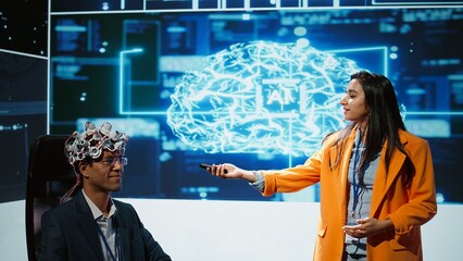 Speaker does EEG headset presentation during tech convention, demonstrating successful...