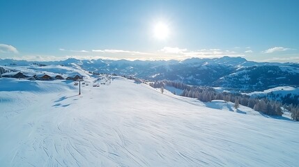 Fototapeta premium Breathtaking mountain views over a snow-covered landscape under a clear blue sky during winter season
