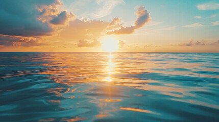 Naklejka premium A Serene Ocean Sunset with Vibrant Colors Reflecting on the Calm Water, Creating a Tranquil and Breathtaking Coastal Scene.