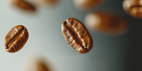 Fototapeta premium Roasted coffee beans falling against a blurry background