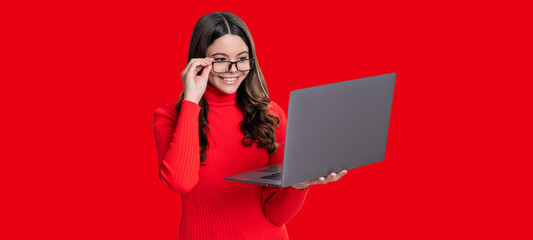 Teen girl with laptop isolated on red. Teen girl study online. Online education. Back to school. Knowledge and online education. Video lesson on laptop. Online courses