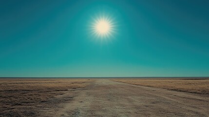 Bright sun shining in a cloudless blue sky over a wide horizon, symbolizing clear weather and a fresh start to the day.