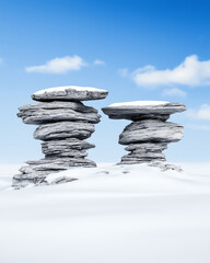 Majestic rock formations rise above snowy landscape under clear blue sky, creating serene and tranquil scene. unique shapes of rocks contrast beautifully with white snow, evoking sense of wonder and
