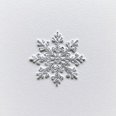 white and silver snowflake ornament on a white background