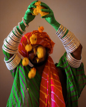 Man posing in sari and a pagri