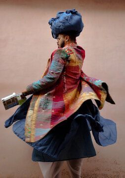 Man posing in sari and a pagri