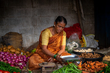 Old woman selling vegetable