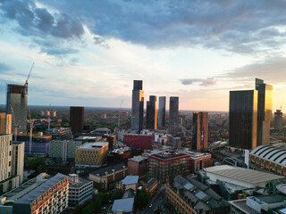 Obraz premium Aerial View of Greater Manchester City Centre and Tall Buildings During Golden Hour of Sunset, England UK. High Angle View Was Captured with Drone's Camera on the day of May 5th, 2024