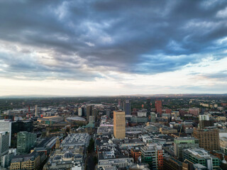 Aerial View of Greater Manchester City Centre and Tall Buildings During Golden Hour of Sunset, England UK. High Angle View Was Captured with Drone's Camera on the day of May 5th, 2024