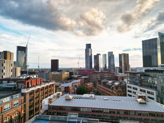 Aerial View of Greater Manchester City Centre and Tall Buildings During Golden Hour of Sunset, England UK. High Angle View Was Captured with Drone's Camera on the day of May 5th, 2024