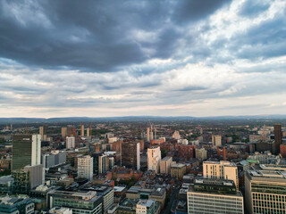 Aerial View of Greater Manchester City Centre and Tall Buildings During Golden Hour of Sunset, England UK. High Angle View Was Captured with Drone's Camera on the day of May 5th, 2024