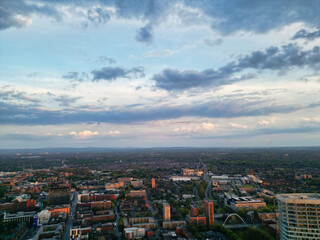 Obraz premium Aerial View of Greater Manchester City Centre and Tall Buildings During Golden Hour of Sunset, England UK. High Angle View Was Captured with Drone's Camera on the day of May 5th, 2024