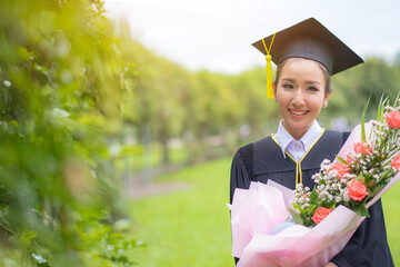 Graduate woman students wearing graduation hat and gown, congratulations for end of study	