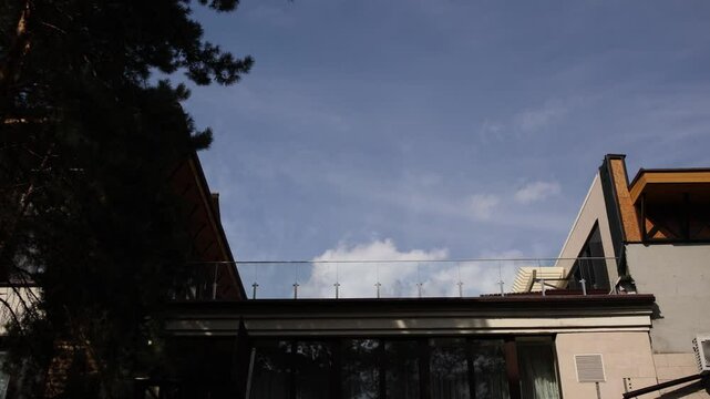 blue sky with clouds above the restaurant in the forest