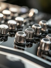 Close-up of mixer knobs and dials with sharp lighting, leaving room for text