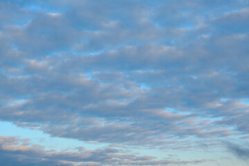 Fototapeta premium Heavy grey autumn clouds on a bright blue sky. Perfect for nature and weather themed projects