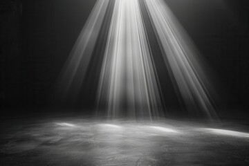 Obraz premium Light beams shining through a dark space, creating a dramatic spotlight effect.