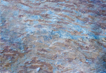 Blue and brown limestone floor, rough texture, stone background, abstract background.