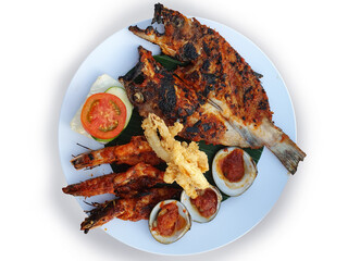 A Plate of Grilled seafood. Jimbaran Seafood Bali. Top view.