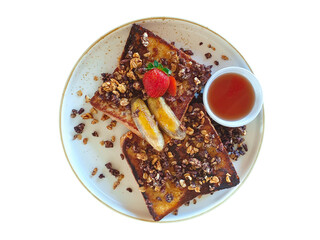 A plate of French toast with caramel, banana, fresh Strawberry and granola. Delicious toasts with...