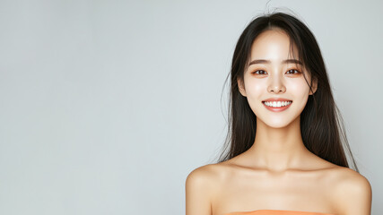 Obraz premium Korean woman smiling wearing traditional cloth isolated on gray