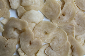 Kerupuk bawang, or garlic crackers, from Indonesia. Before cooked. Close up view, flat lay or top view